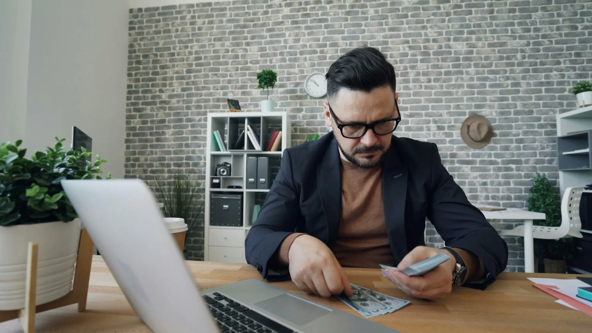 Man working at a laptop on a video call
