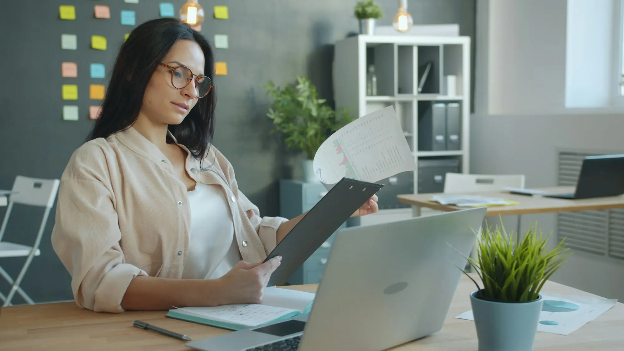 Woman working with documents at an office desk